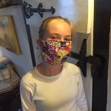 Load image into Gallery viewer, Picture of girl wearing 3-D facemask in day of the dead design